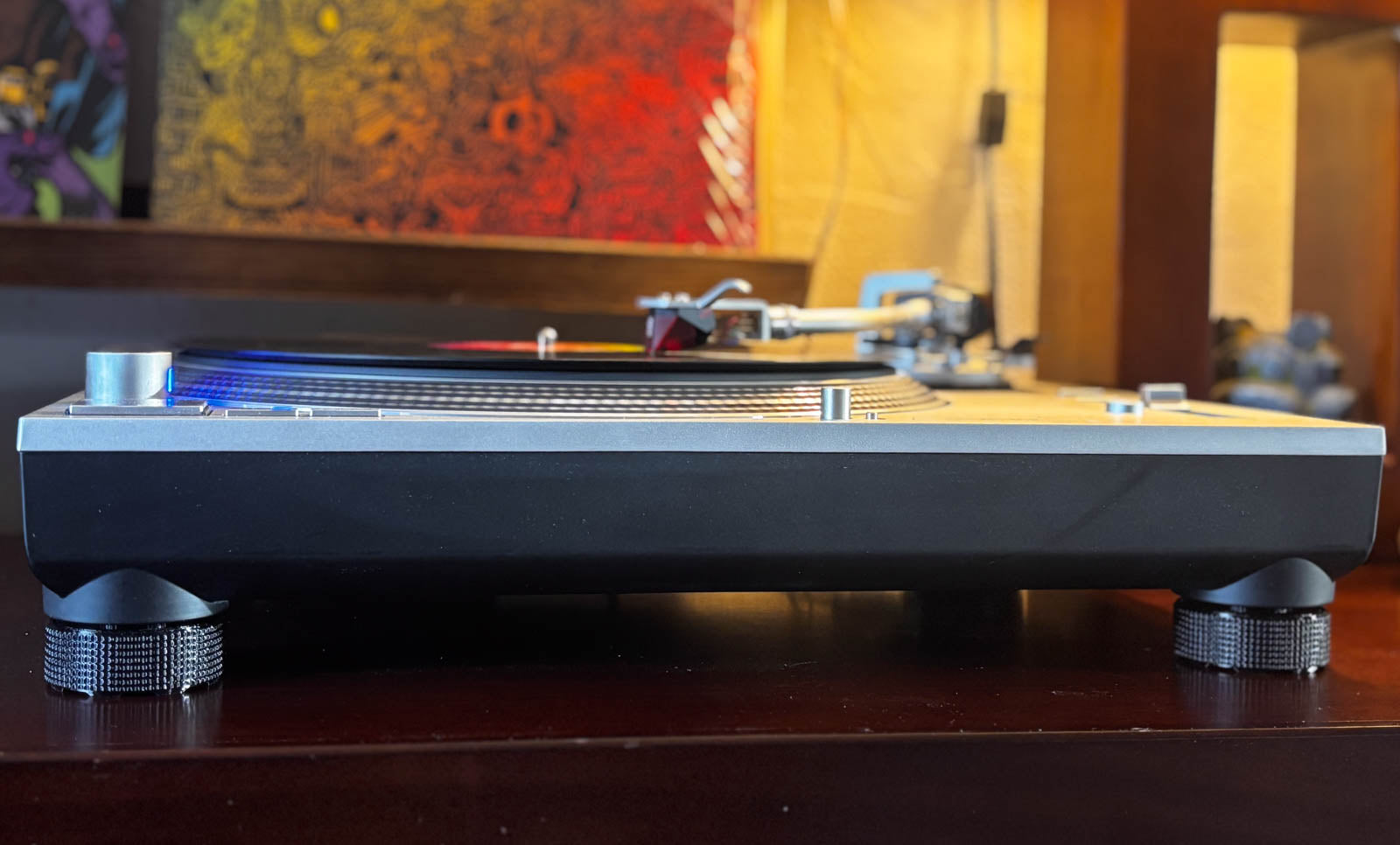 Front view of a Technics SL-1200 turntable with SpinCandy isolation feet installed. Shows external fit and real-world use.